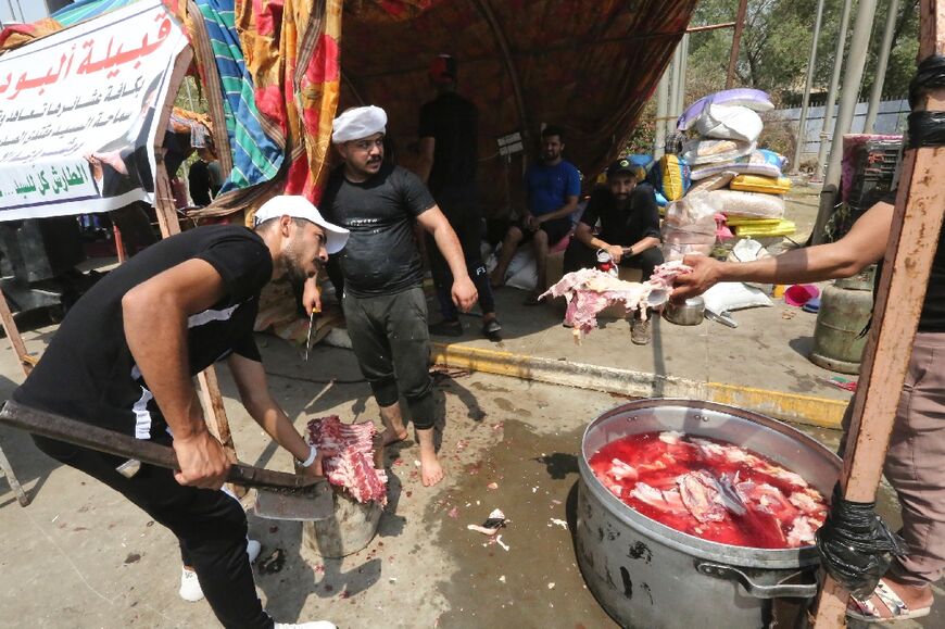 Supporters of Iraqi cleric Moqtada Sadr prepare food for others during a protest and sit-in at Iraq's parliament