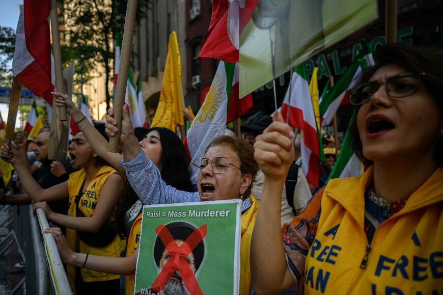 Protesters in New York attend a rally calling for the prosecution of Iran's President Ebrahim Raisi, during the United Nations General Assembly 