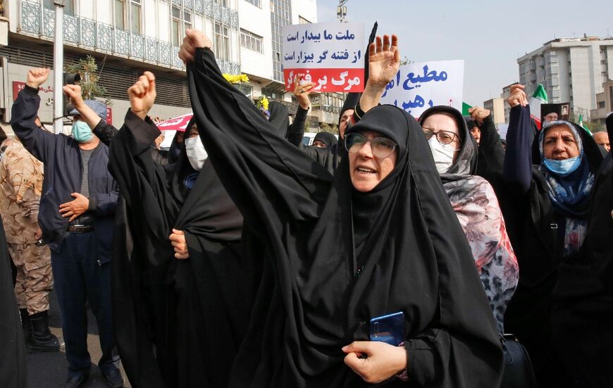 Iranians rally to denounce a mass shooting at a key shrine in the southern city of Shiraz