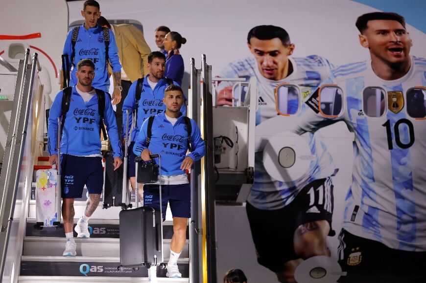 Argentina's forward Lionel Messi (2R) and teammates arrive  in Doha ahead of the World Cup football tournament: Qatar hopes the sporting stars will inspire children