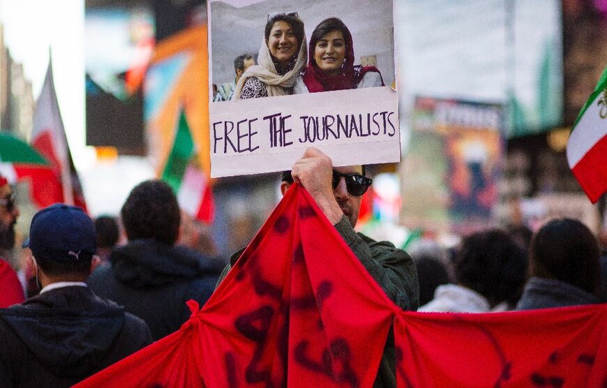Demonstrators gather at Times Square in New York during a protest in support of women's freedom in Iran