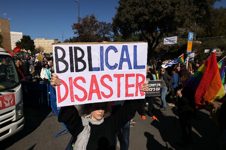 Israeli activists and members of the LGBTQ community protest outside the Knesset 