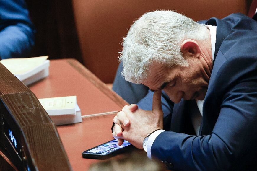 Outgoing centrist premier Yair Lapid at the special session of the Knesset set to approve and swear in Netanyahu's new right-wing government