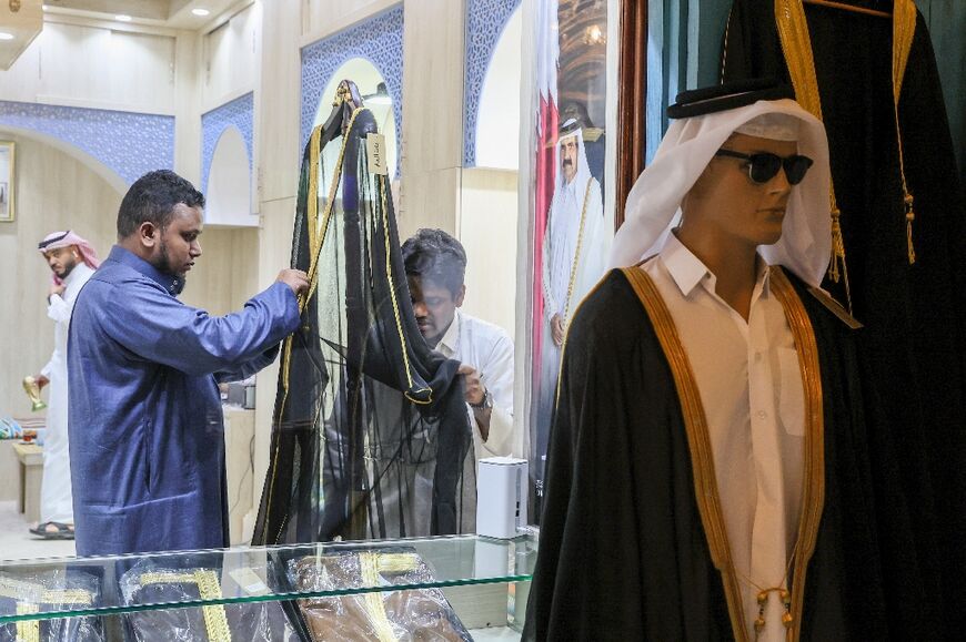 Each bisht takes a week to make and goes through a seven stage completion, with different workers adding different lines of gold braid to the front and arms