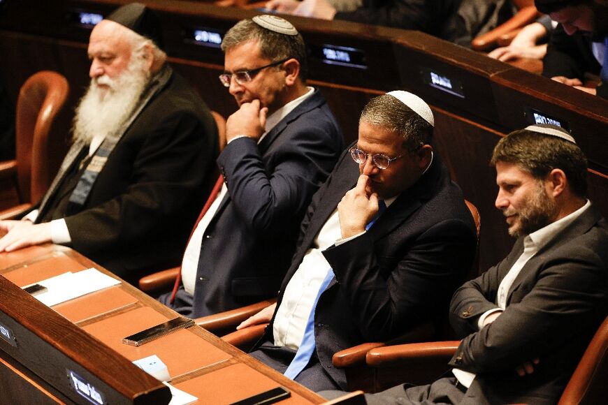 Right-wing Knesset members Itamar Ben-Gvir, second from right, and Bezalel Smotrich, on the right, attend the special session to approve and swear in a new government