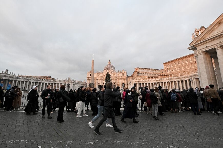 They began queuing before dawn to view Benedict's body, which was transferred early Monday from the monastery in the Vatican grounds where he died Saturday aged 95