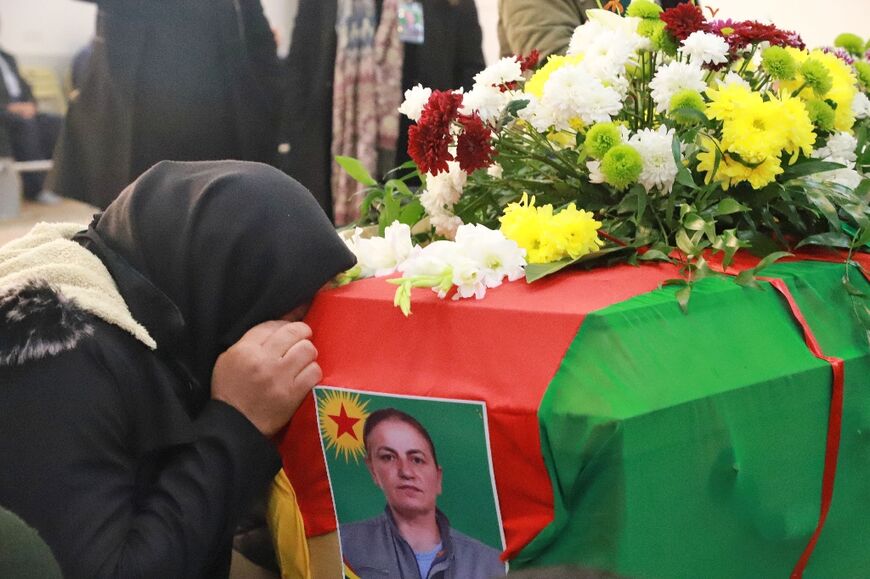 Iraqi Kurds attend the funeral of Emine Kara, a Kurdish woman who was killed during a shooting attack in Paris last month, in the Kurdish city of Sulaimaniyah in northern Iraq