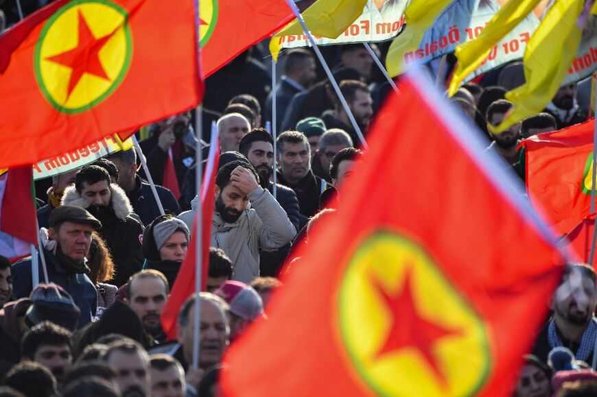 Thousands gathered outside the ceremony with flags of the Kurdish Workers' Party (PKK)
