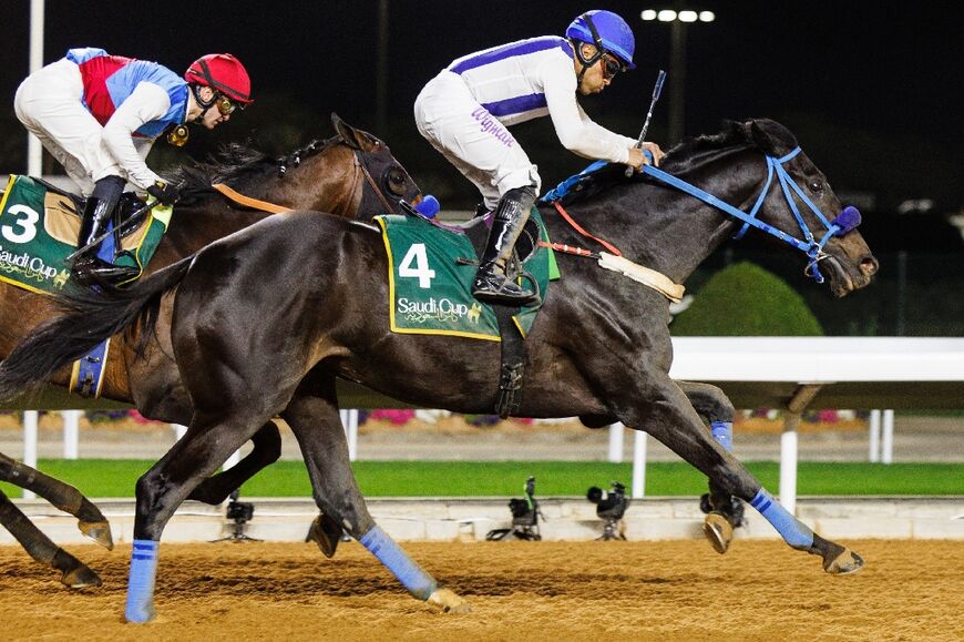 Saudi longshot Emblem Road ridden by Panamanian jockey Ramos, came from behind to claim a shock win in the world's richest horserace, the $20 million Saudi Cup.