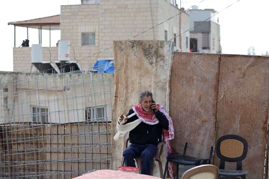 Moussa, the father of Khayri Alqam, sits outside his family home which is to be demolished under long-standing Israeli policy