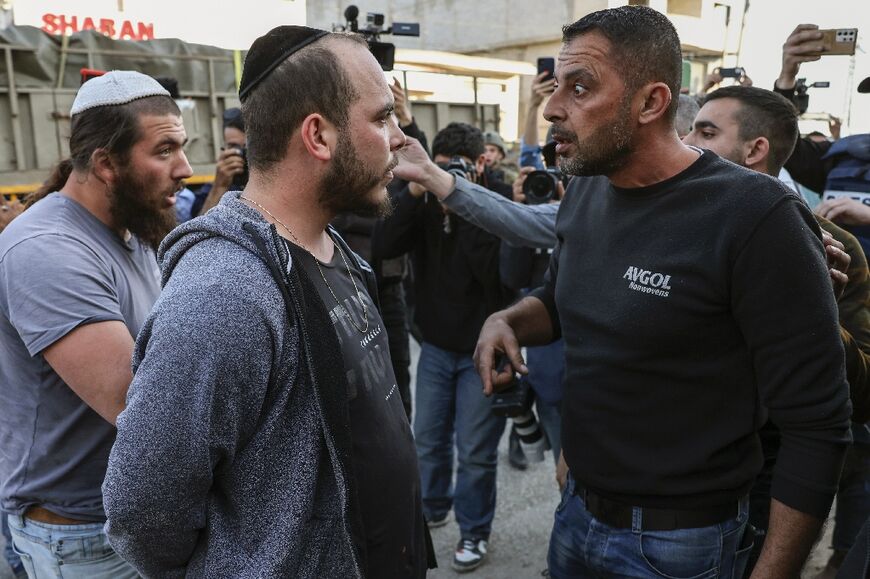 Palestinians argue with an Israeli settler in Huwara, the occupied West Bank 