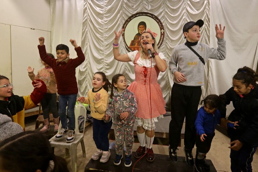 Entertainers put on a show for children at a church in Syria's government-held northern city of Aleppo 