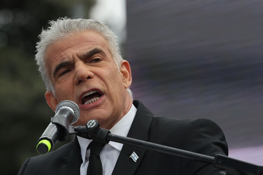 Israel's opposition leader and former premier Yair Lapid addresses protesters  