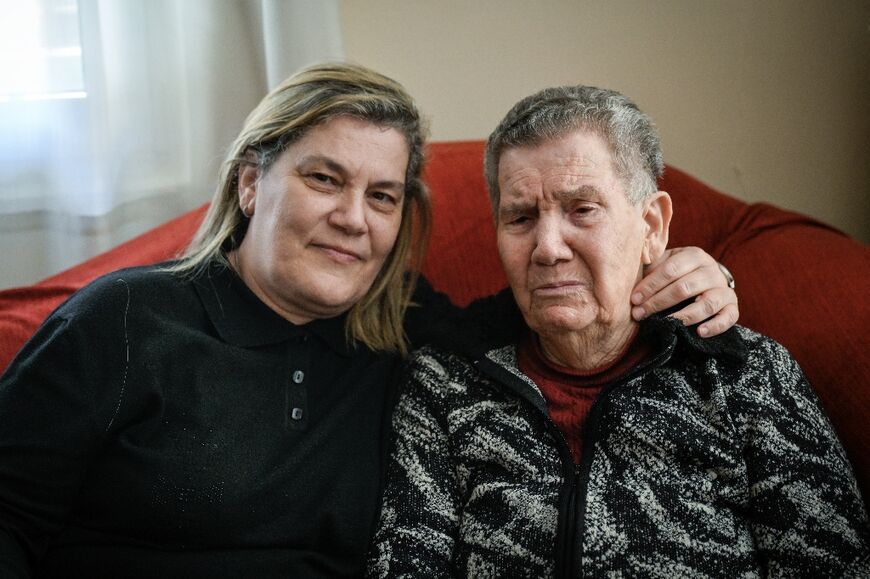 Greek Holocaust survivor Naki Bega is comforted by her daughter Myriam as she tells her story