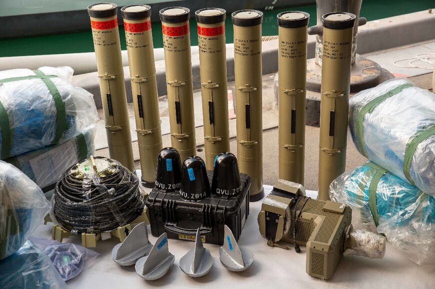The US Navy displays weapons it says were seized from the intercepted vessel, including Iranian versions of Russia's Kornet anti-tank missile and medium-range ballistic missile components