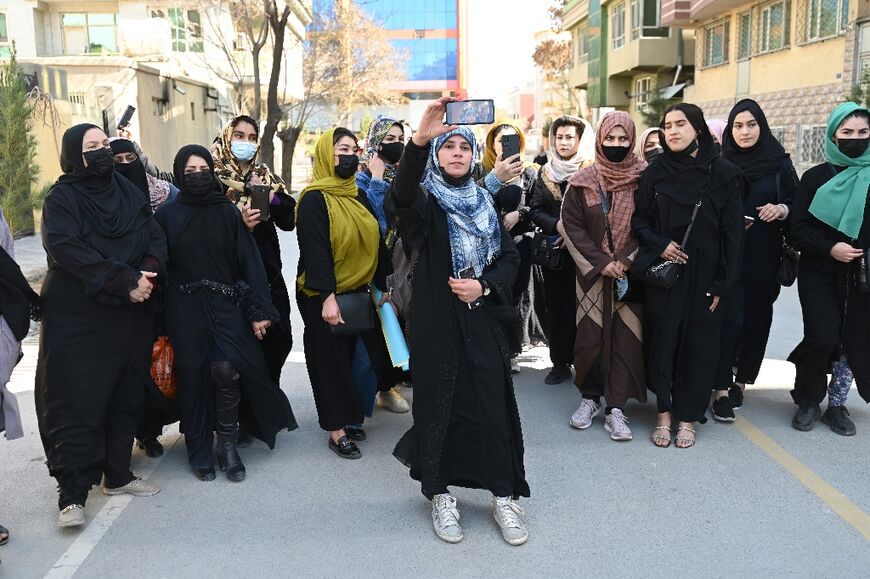 Afghan women stage a protest for their rights to mark International Women's Day in Kabul