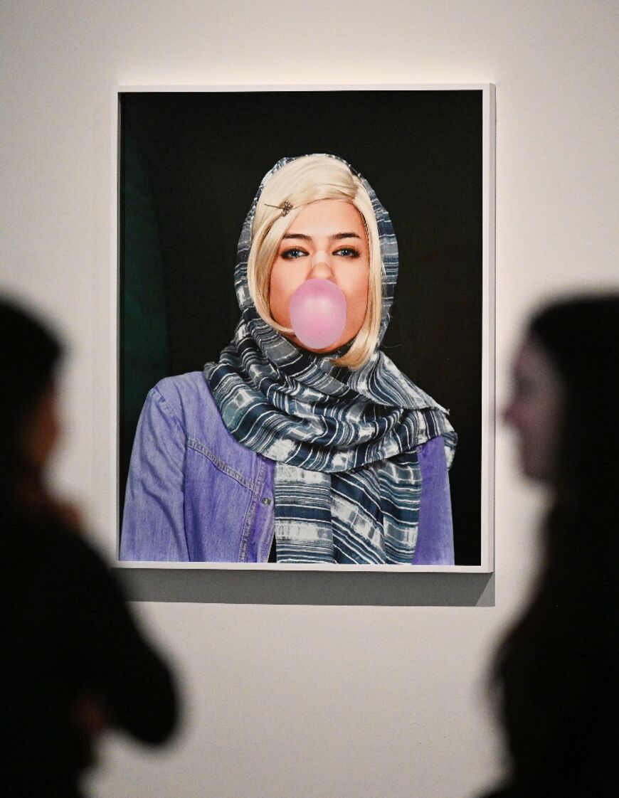 'Miss Hybrid No. 3, 2008' by the Iranian-born artist Shirin Aliabadi depicts a young woman with a blonde wig poking out from under her veil as show blows a bubble