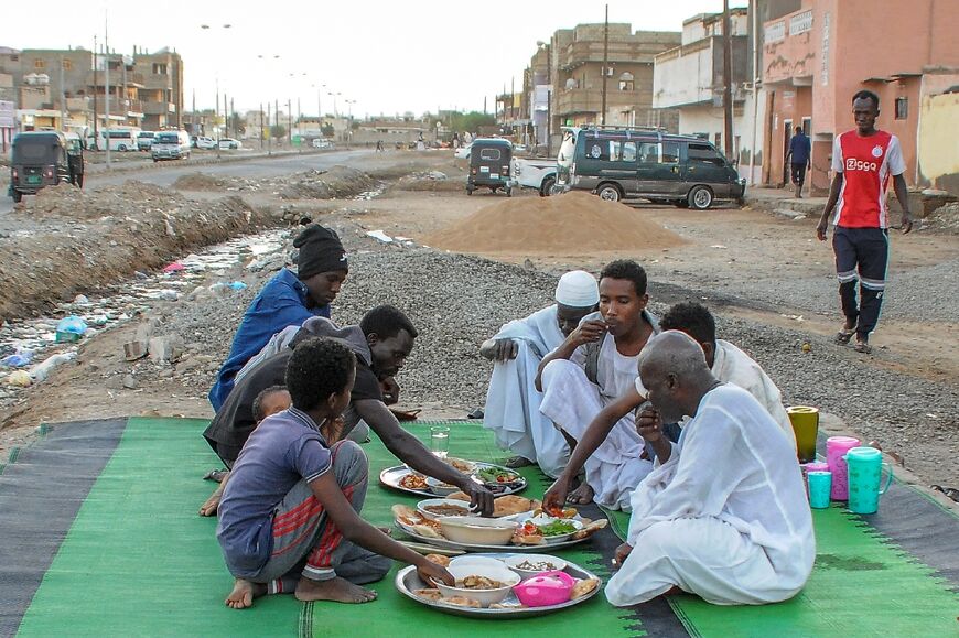 Residents of Port Sudan break their Ramadan fast at sunset, with the country engulfed in battle between two generals