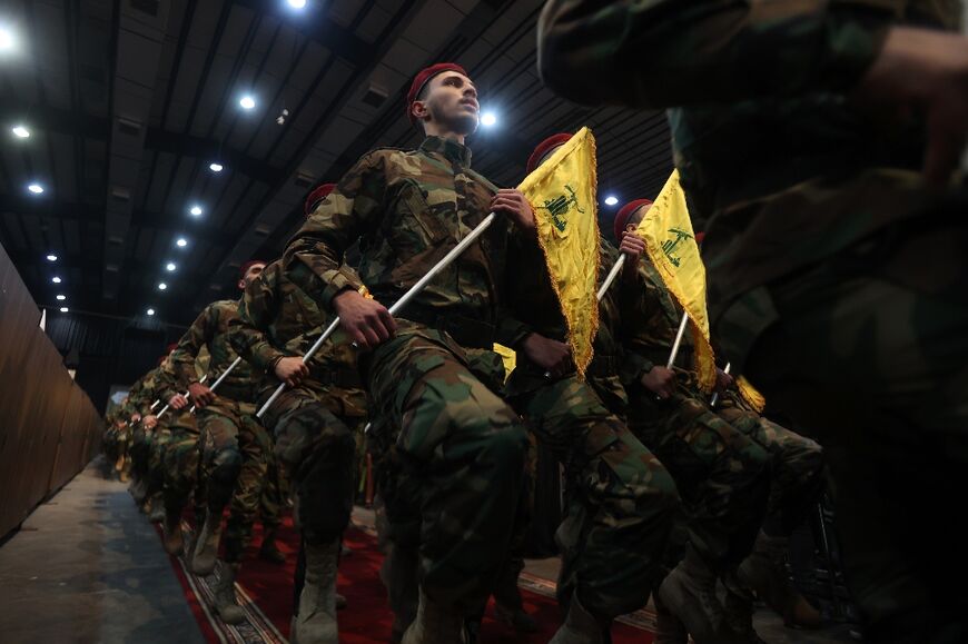 Militants with the Lebanese Shiite movement Hezbollah, parade in Beirut in support of the Palestinian people 