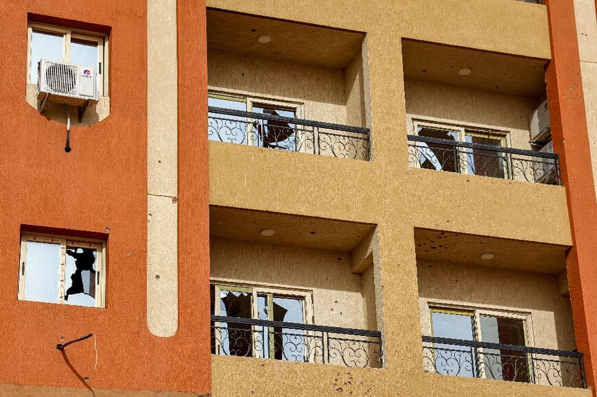 Broken windows at a residential building in Khartoum in the aftermath of fighting