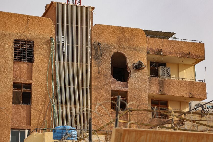 A hole from an explosion is left on the side of a building in Khartoum on April 18