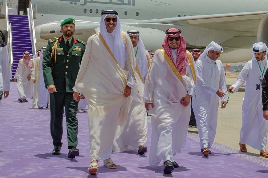 Qatar's Emir Sheikh Tamim bin Hamad al-Thani makes his way to the summit