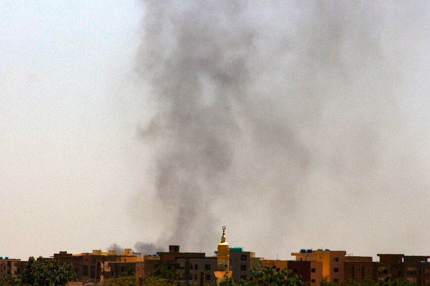 Smoke rises above buildings in war-ravaged Khartoum