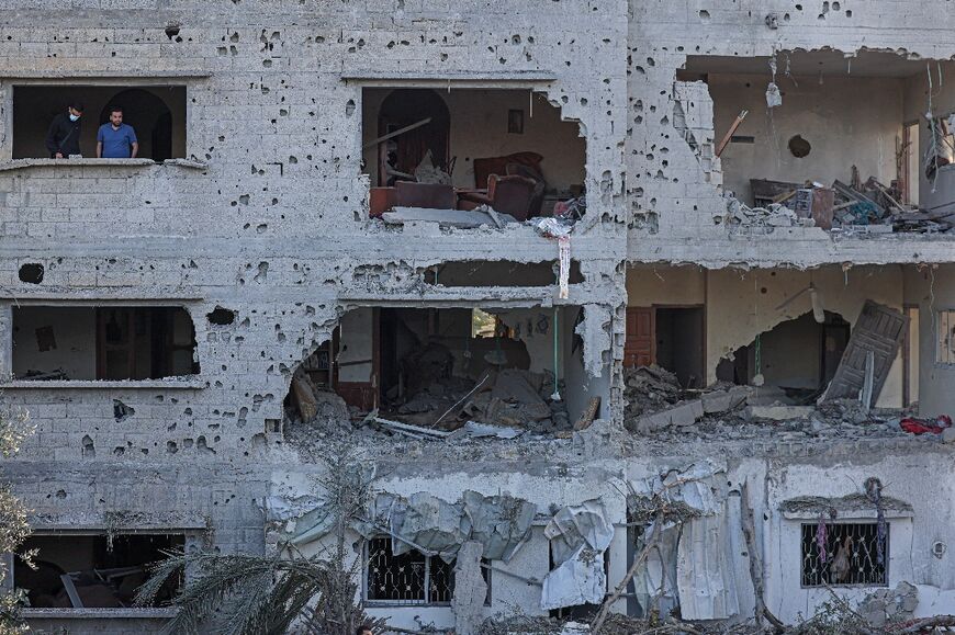Palestinians inspect destroyed homes in Deir al-Balah