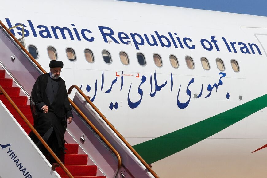 Iranian President Ebrahim Raisi leaving his plane after landing at Damascus International Airport on May 3, 2023