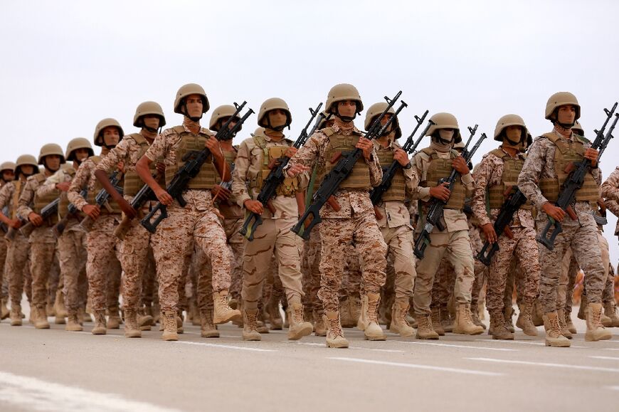 Soldiers take part in a military parade during a graduation ceremony for new cadets of the Saudi-backed and internationally-recognised Yemeni government in Yemen's northeastern province of Marib on June 24, 2023