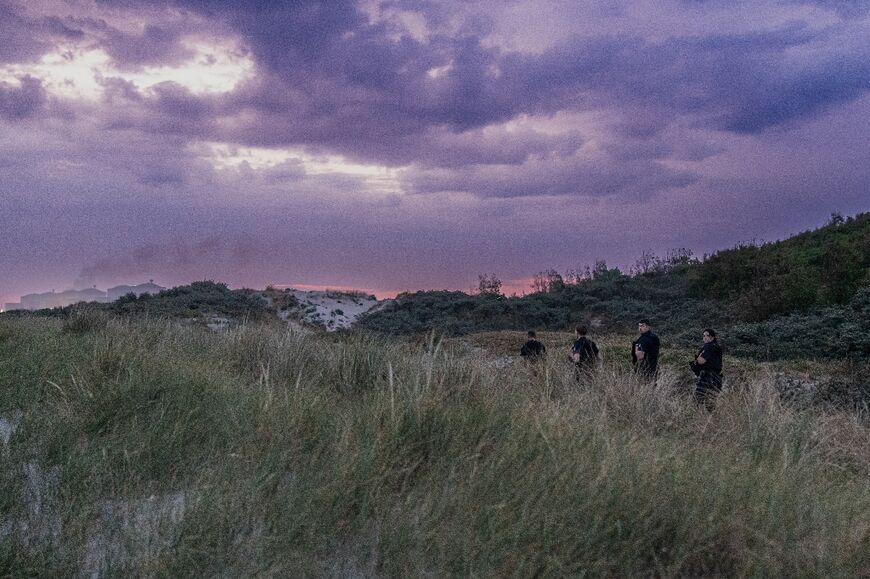 French Republican Security Corps (CRS)  search the dunes for migrants attempting to cross the English Channel 