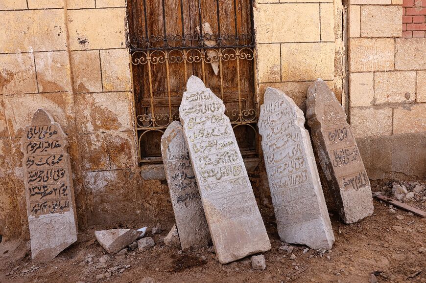 Tomb stones are lined up against a wall in the historic Ein al-Sera cemetery in east-central Cairo