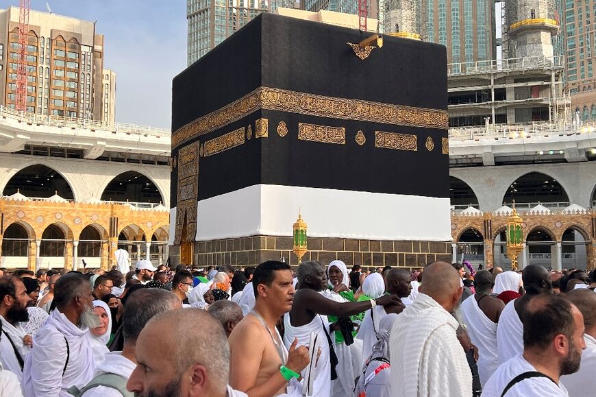 The first hajj ritual requires walking seven times around the Kaaba, the large black cubic structure at the centre of Mecca's Grand Mosque
