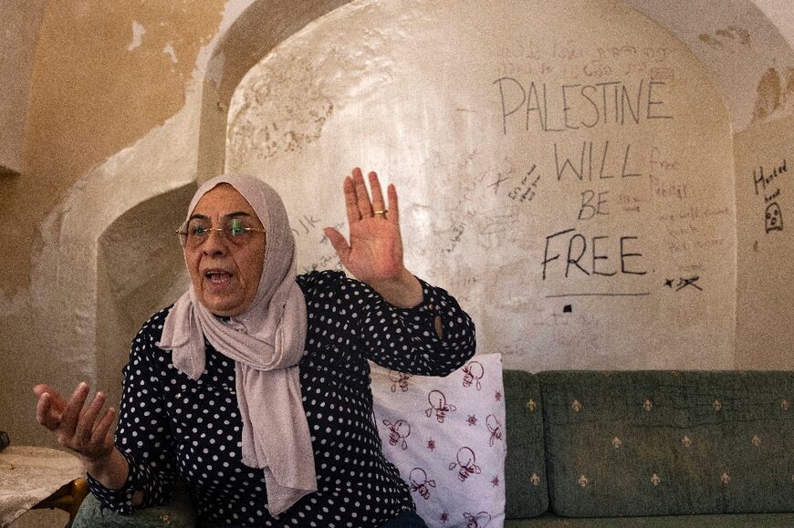 Messages scribbled on the wall by their grandchildren are one of the few things left in the almost empty apartment after the couple removed everything of sentimental value for fear of losing it when Israeli police move in to evict them