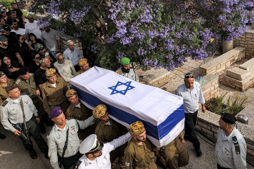 Soldiers carry the coffin of Ori Izhak Iluz, in the city of Safed in northern Israel