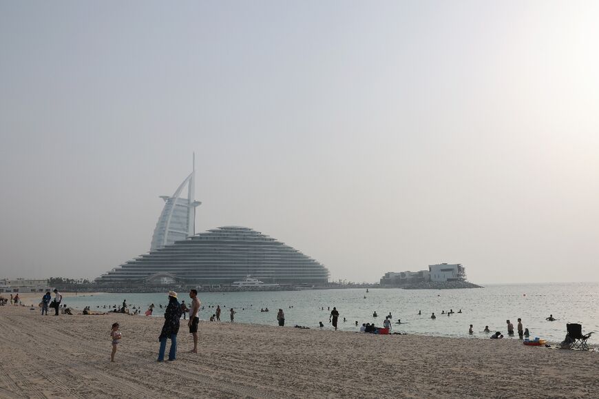 Some people take to Dubai's beaches to seek respite from the heat