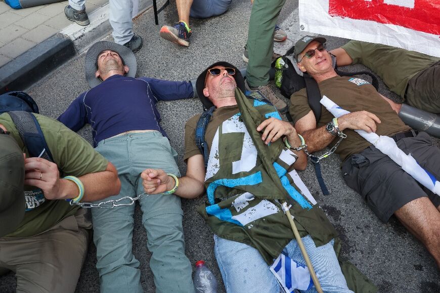 Israeli protesters block several roads as well as an entrance to the army headquarters in Tel Aviv