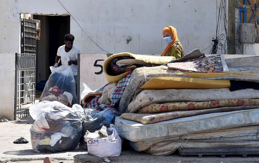 Migrants empty a house they were renting, in Sfax on July 5, 2023