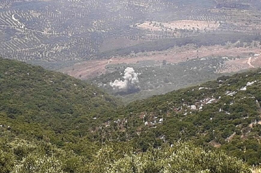 Smoke from Israeli shelling rises in the fields between Kfar Chouba and Halta, in southern Lebanon 