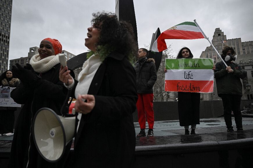 Activists condemn the mass poisoning of Iranian female students, at a rally in New York on March 11, 2023 