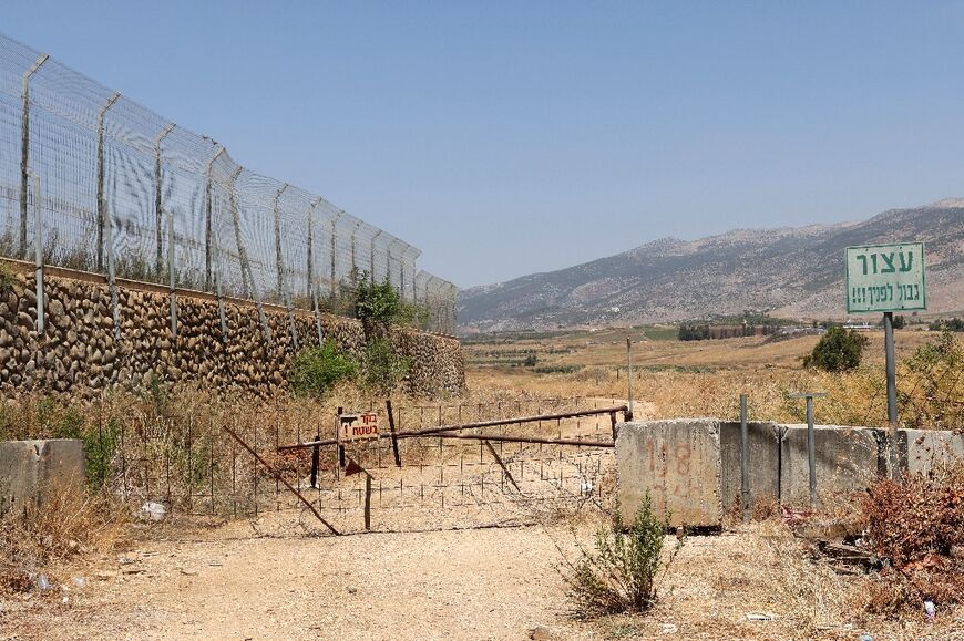 A sign in Hebrew next to the border fence with Lebanon