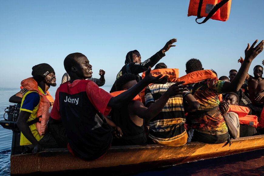 Some of the 266 migrants rescued by members of the Spanish NGO Proactiva Open Arms when they were crossing the Mediterranean
