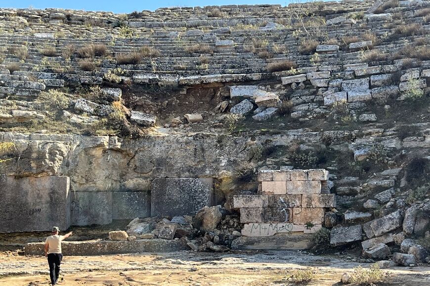 Blocks of marble that formed part of the auditorium of Cyrene's ancient amphitheatre lie strewn on the gound after being dislodged by the torrential rains that accompanied  Storm Daniel