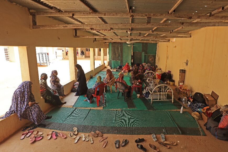 Women displaced by Sudan's war sit at a mosque in Wadi Halfa, near Egypt 