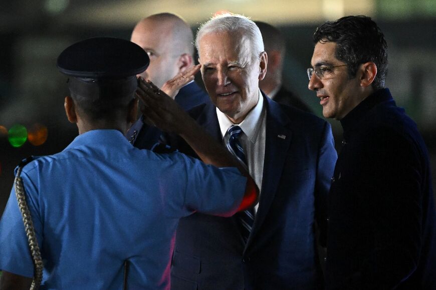 US President Joe Biden is greeted upon arrival at the airport for the G20 summit in New Delhi on September 8, 2023