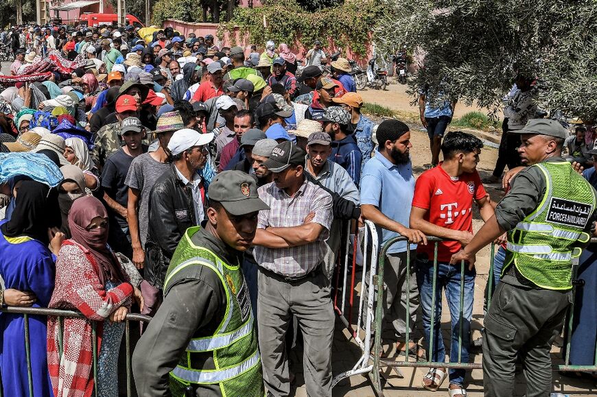 A long queue awaits temporary shelters after Morocco's quake