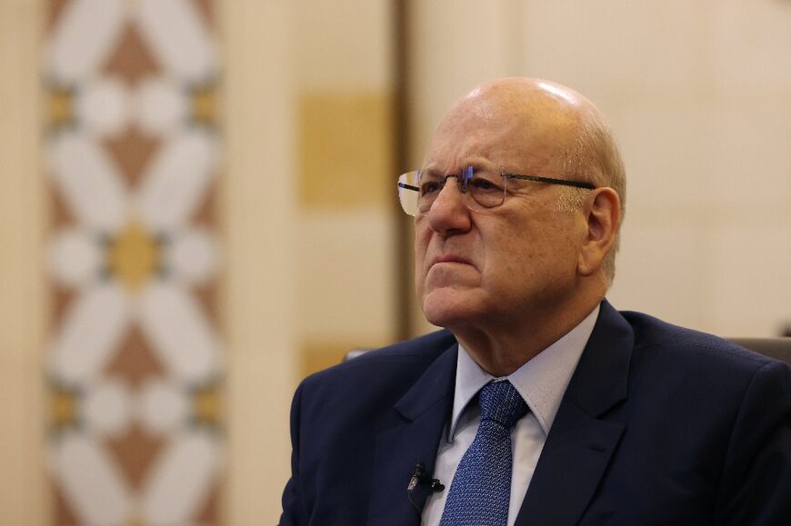 Lebanon's caretaker prime minister Najib Mikati listens to a question during an interview with AFP at his office in Beirut on October 30, 2023. Mikati said he was working to "prevent Lebanon from entering the war" between Israel and Hamas.