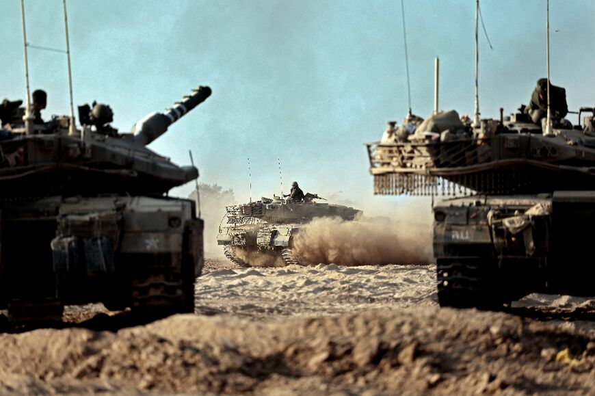 Israeli tanks are among the heavy weaponry being sent to the border with Gaza