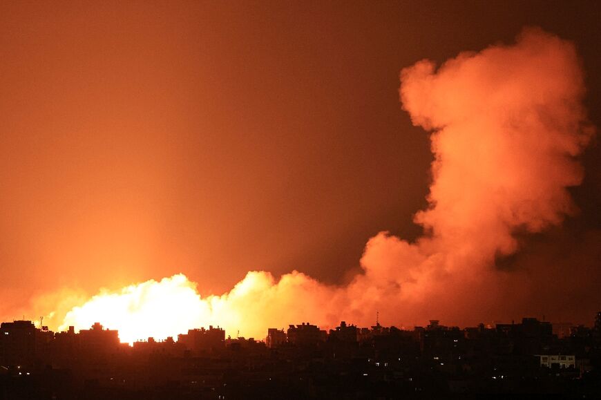 Explosions illuminate the sky during Israeli strikes on Gaza City on Tuesday