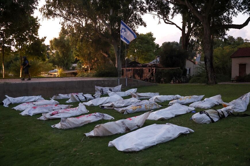 Covered bodies at kibbutz Beeri near the border with Gaza, the site of an infiltration by Palestinian militants on the weekend, on October 11, 2023